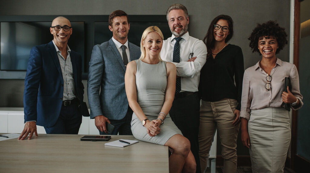 Diverse business professionals together in meeting room